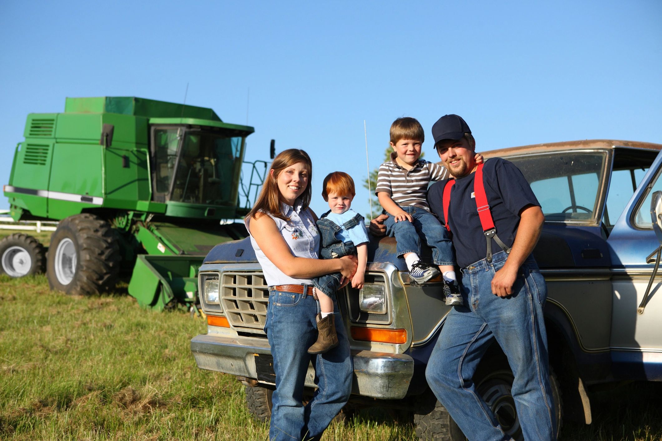 Farm family: mother, father and two sons with