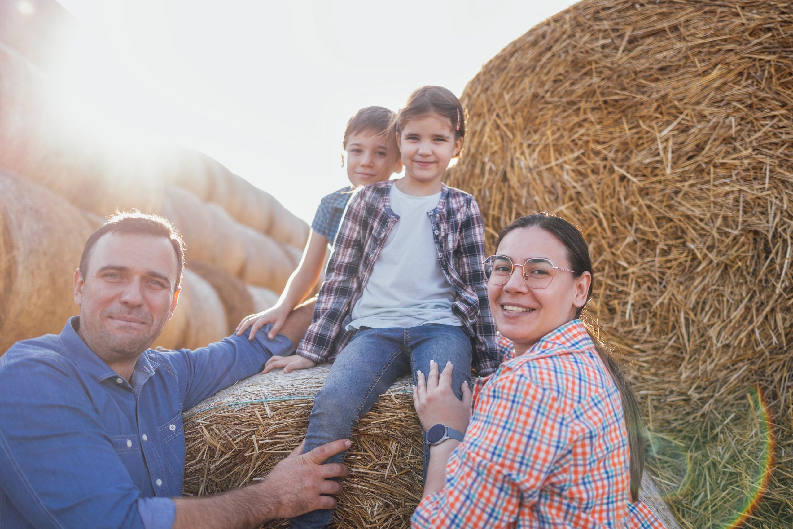 A young happy family of farmers in casual